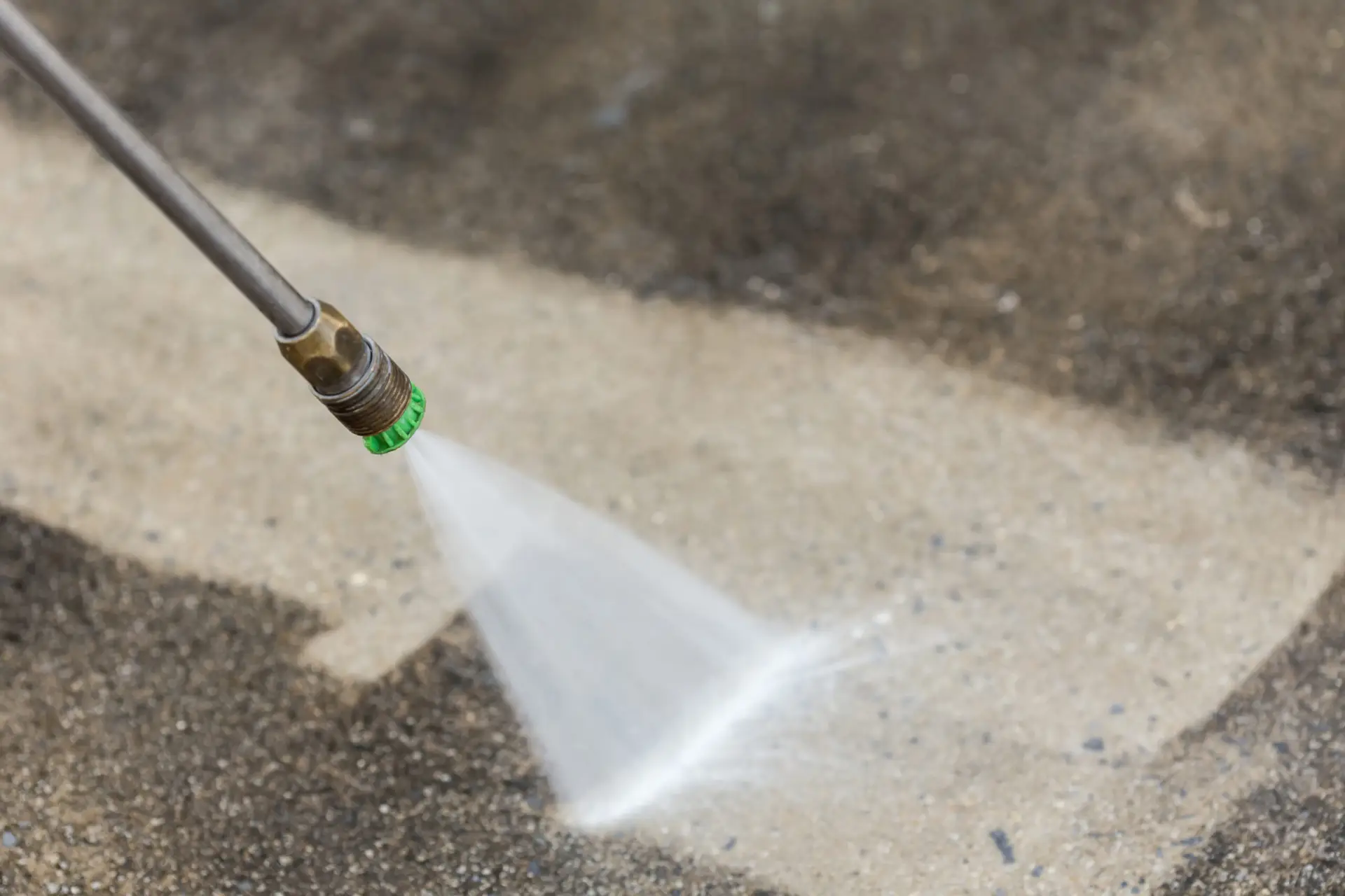Pressure washing concrete surface as part of Zenith Paint and Finish exterior cleaning services in Powell WY