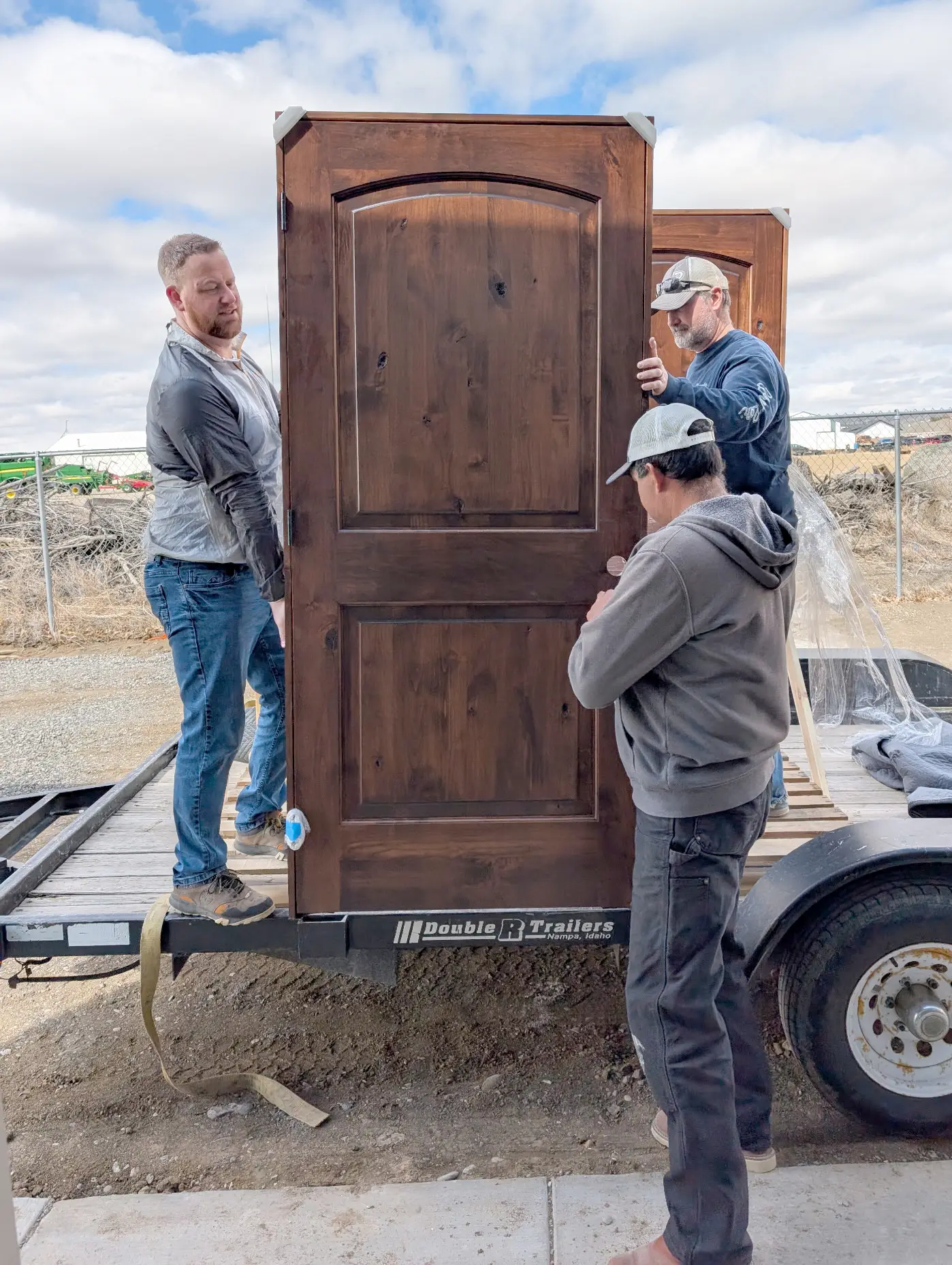 Custom wood front doors delivered for residential home installation