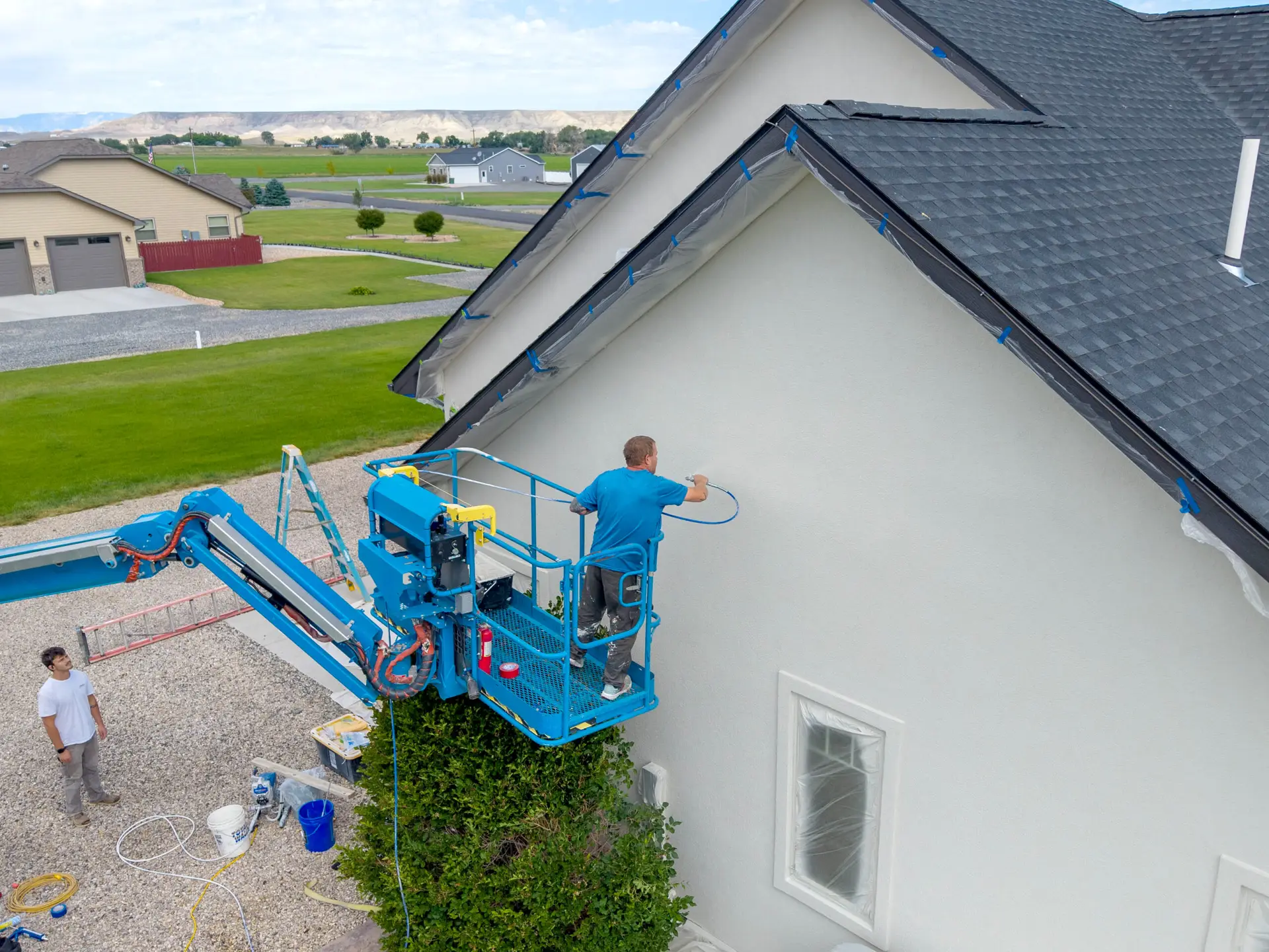 Exterior house painting completed with professional spray finish