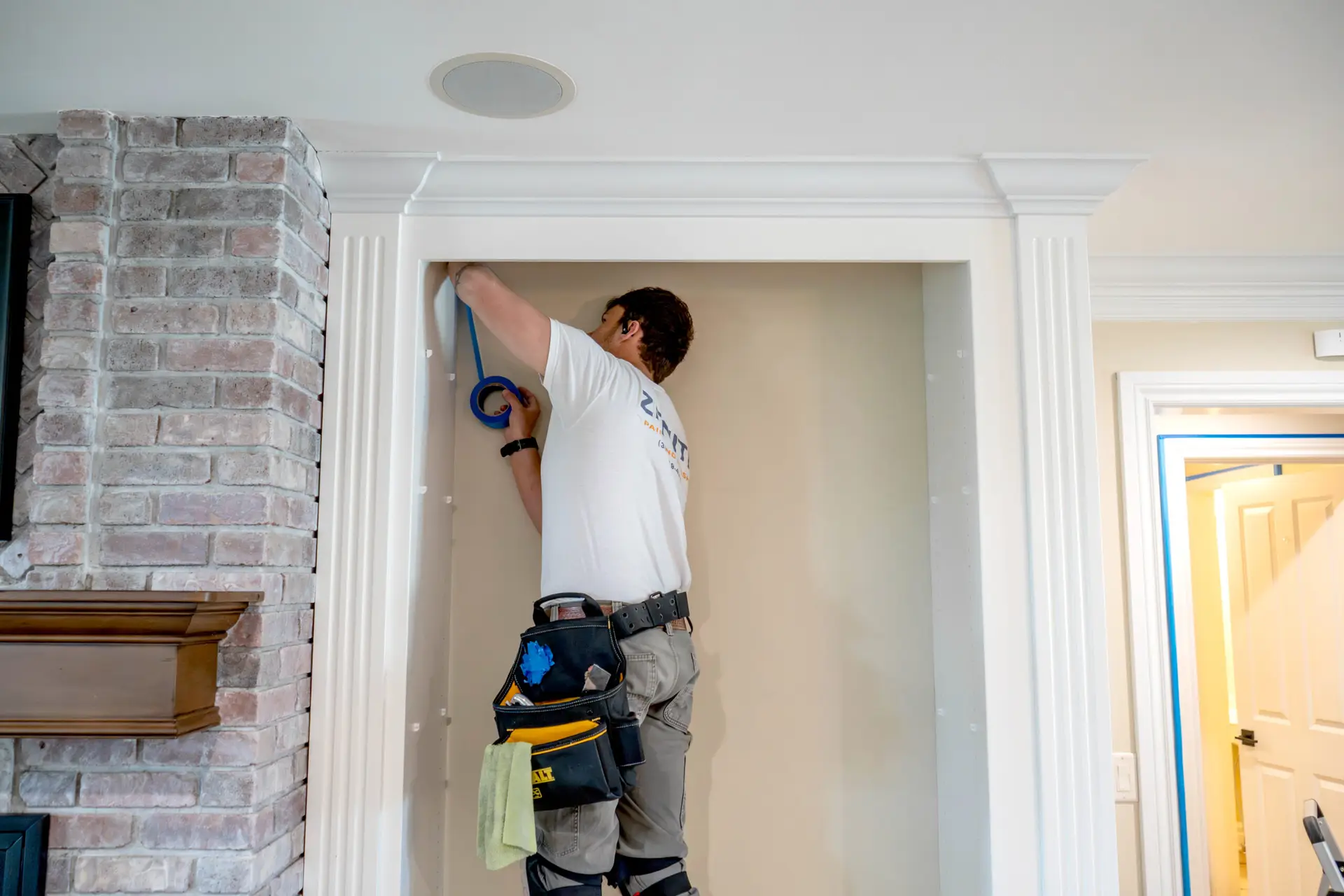 Careful masking around custom built in cabinetry ensures razor sharp paint lines and a flawless finish, a level of craftsmanship Zenith Paint and Finish brings to every interior painting project.
