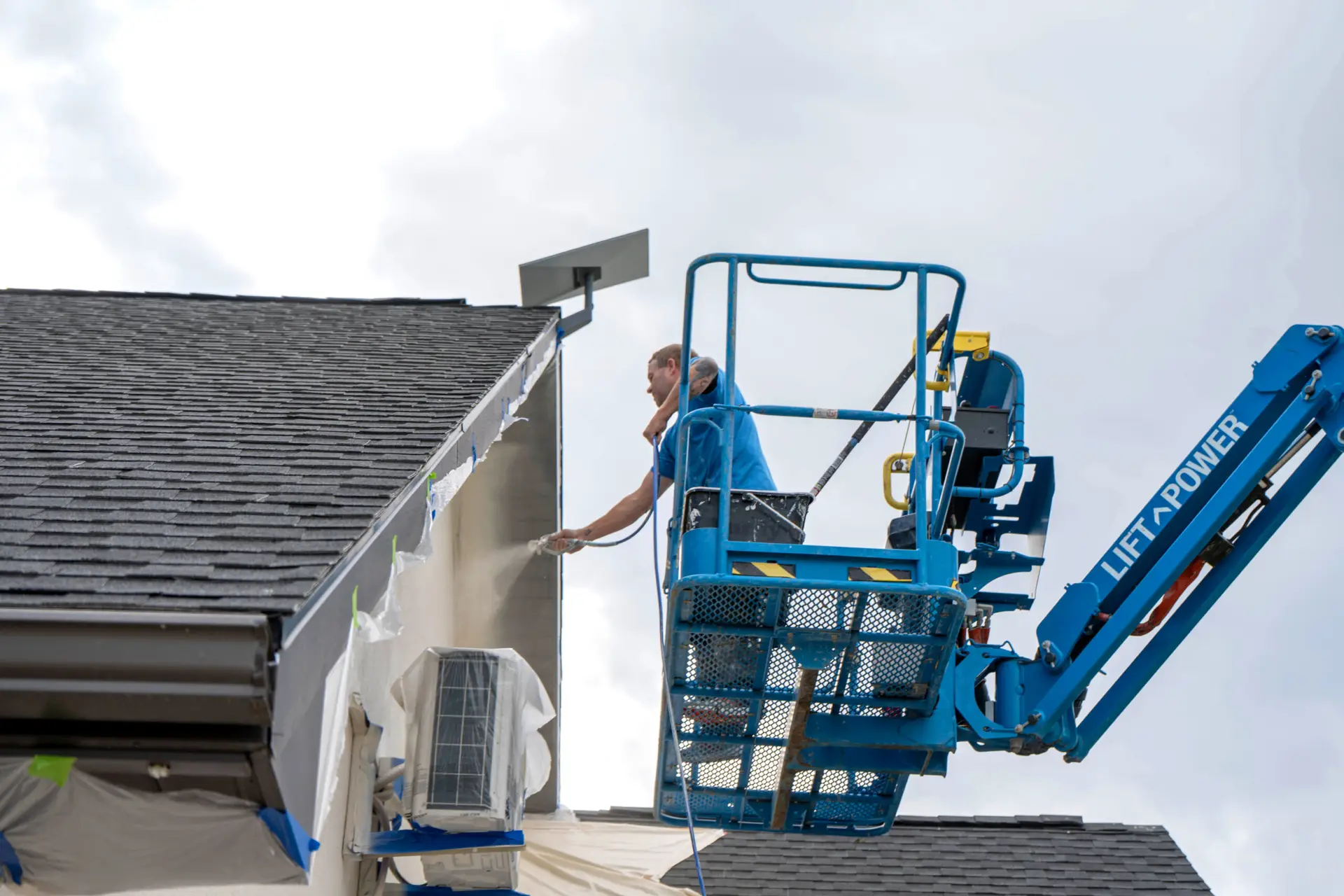 Working safely from a boom lift, Zenith Paint and Finish applies a smooth, even exterior coating that delivers lasting protection and a clean, professional finish on every elevated surface.