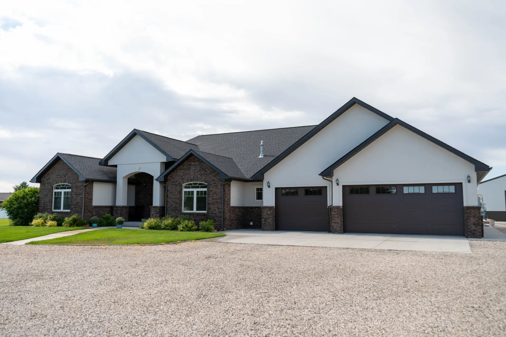 Fresh exterior paint, crisp trim lines, and attention to every architectural detail give this custom home a timeless look completed by Zenith Paint and Finish.